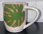 Wheel Thrown Mug Monstera Leaf Handmade 2233 Ceramics Seattle Wa. Fixed Price $24.00.